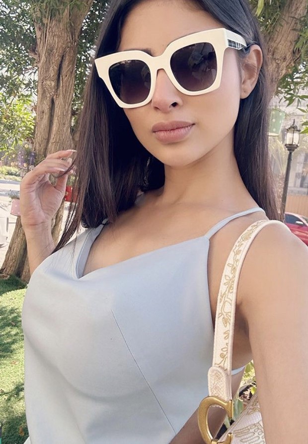 Mouni Roy poses in a pastel-blue dress against a backdrop of azure skies in post-card worthy picture from her Dubai holiday