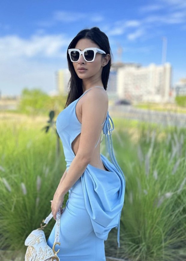 Mouni Roy poses in a pastel-blue dress against a backdrop of azure skies in post-card worthy picture from her Dubai holiday
